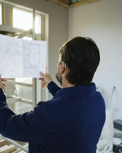 Engineer reviewing a drawing on site