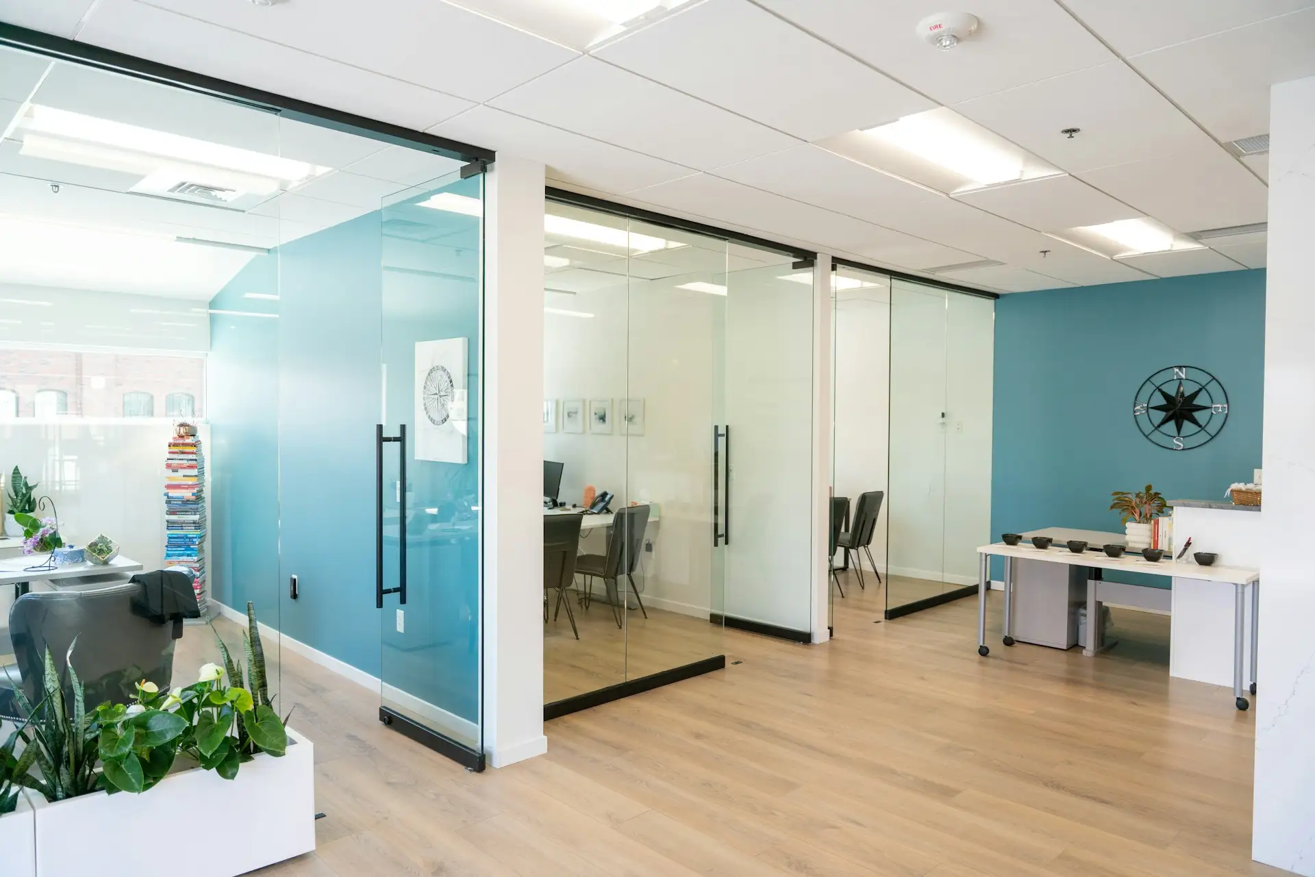 Frameless glass partitions in a bright office