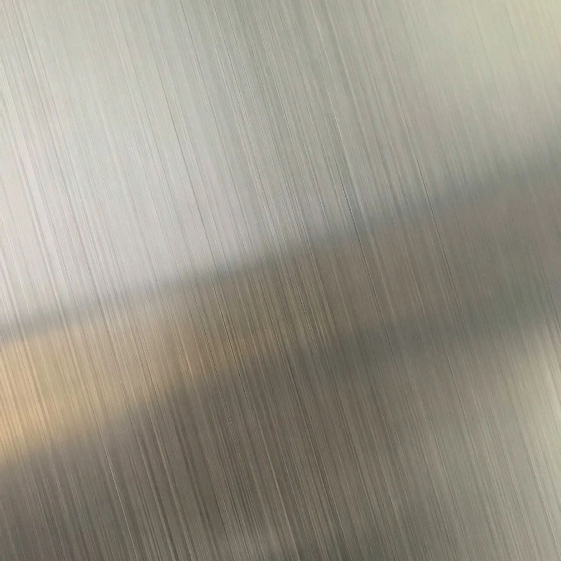 Close-up of a brushed stainless steel surface